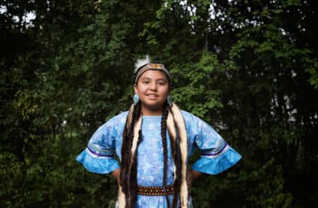 Young native woman in a blue dress