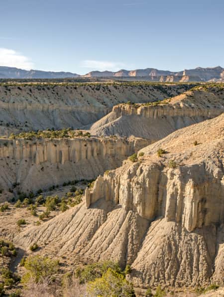 Large white rock formations in a desert landscape.