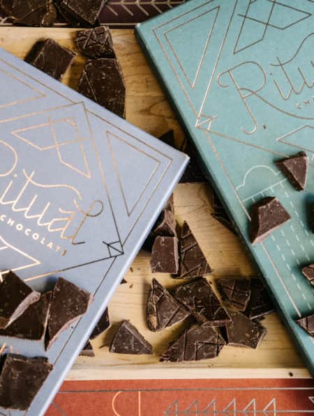 Two packaged chocolate bars from a company called Ritual, displayed as a product shot.