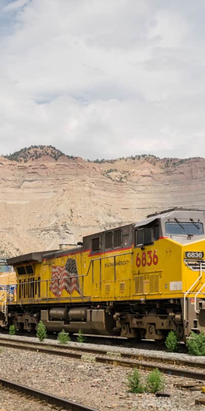 Railroad tracks and Book Cliffs behind Main Street, Helper.