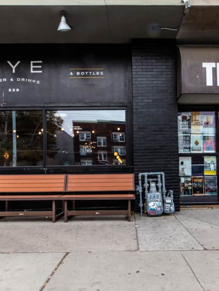 Two side-by-side restaurants with all-black exteriors.