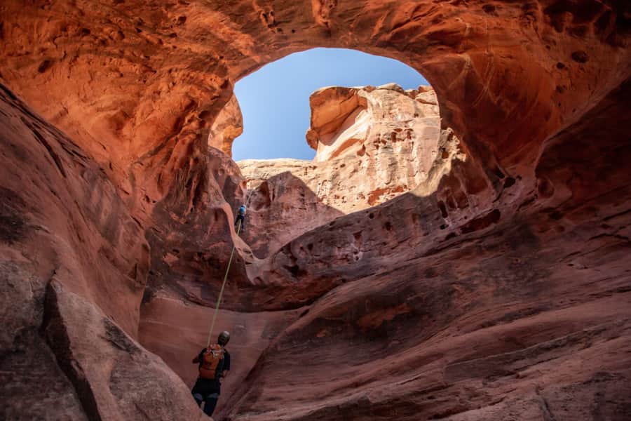 With the help of a guide, visitors can explore deep into North Lake Powell, including exciting rappels, like this one in Hogwarts Canyon.