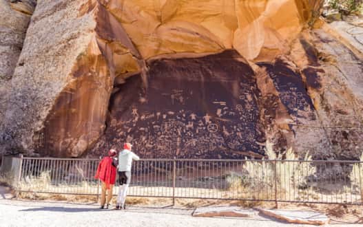 Discover hundreds of petroglyphs at Newspaper Rock along the upper end of Indian Creek Canyon.