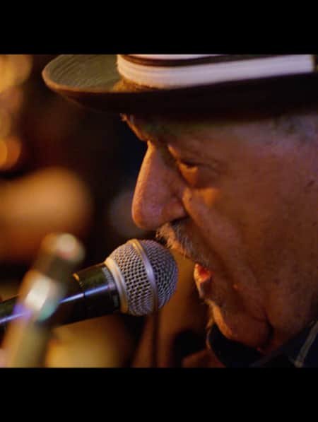 A man singing into a microphone.