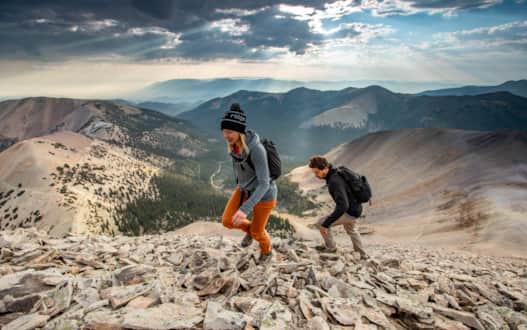 Hikers climbing Delano Peak.