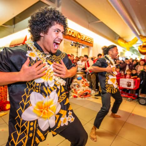 The festival energy is high as performers take to the floor.