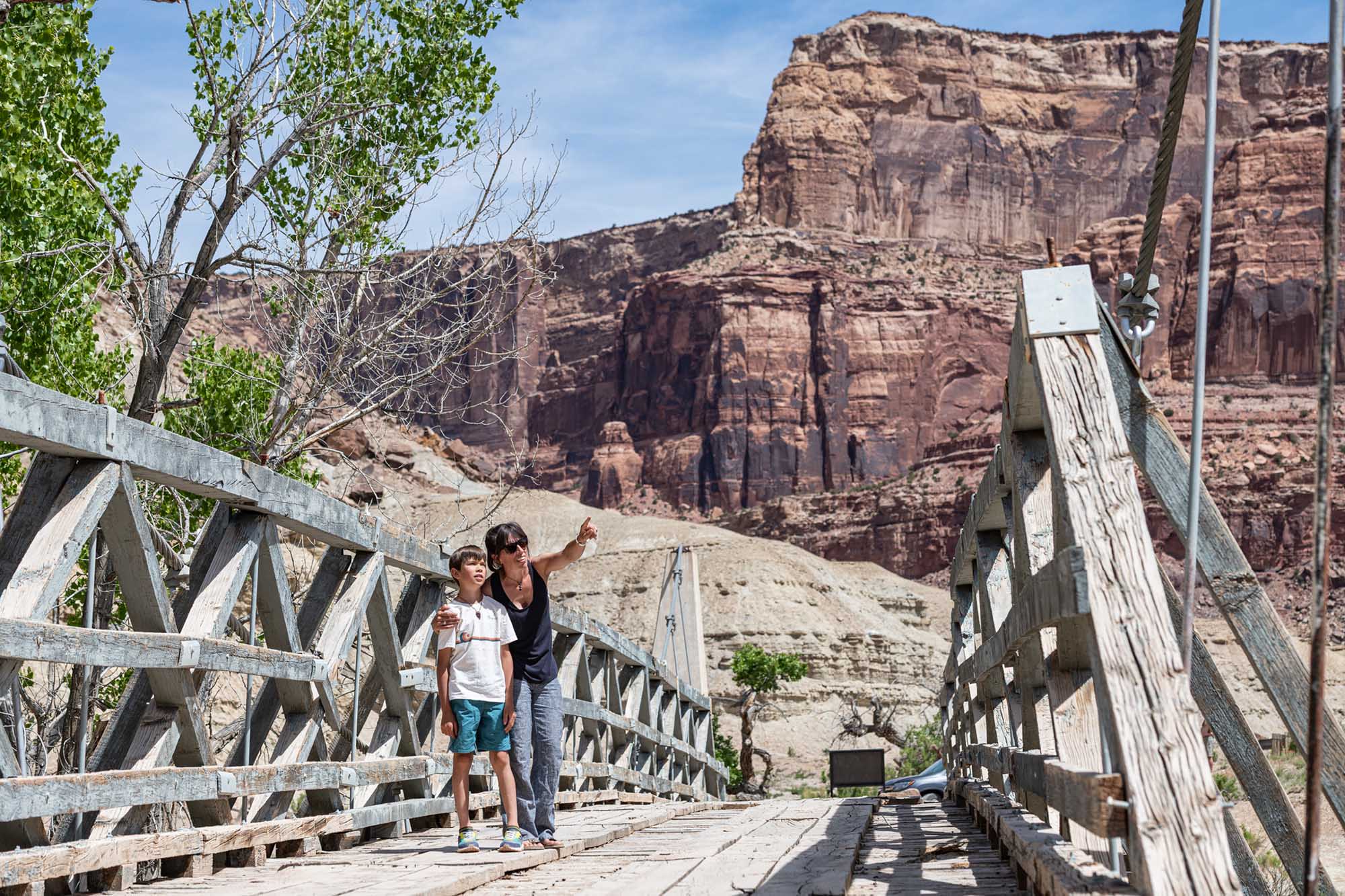 The San Rafael Swinging Bridge (often simply called the CCC Suspension Bridge) is a historic wooden and steel cable suspension bridge that spans the San Rafael River in the northern section of the San Rafael Swell. Built in 1937, it is a fascinating relic of Great Depression-era engineering and holds a distinct title: for decades, it was the only bridge spanning the San Rafael River, turning a notoriously treacherous, isolating water crossing into a reliable route for locals.