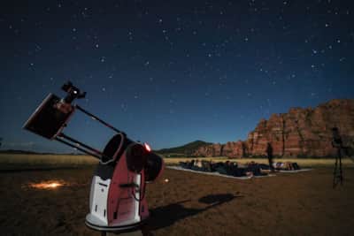 The convenience of a guided stargazing trip is a major plus, as the outfitter supplies items like a blanket, binoculars, a red-light flashlight, a warm beverage, comfortable seating, and of course, high-powered telescopes.