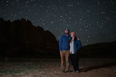 The author and his partner take in the stargazing views at Zion National Park.