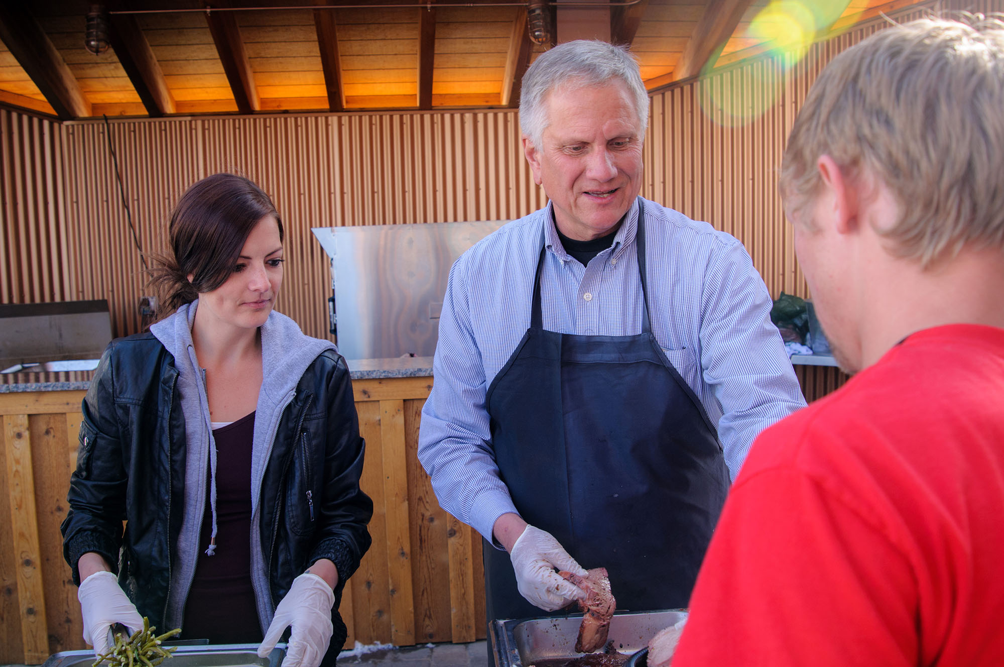 web2000_john-grissinger-brian-head-resort-owner-serving-bbq-photo-mike-saemisch