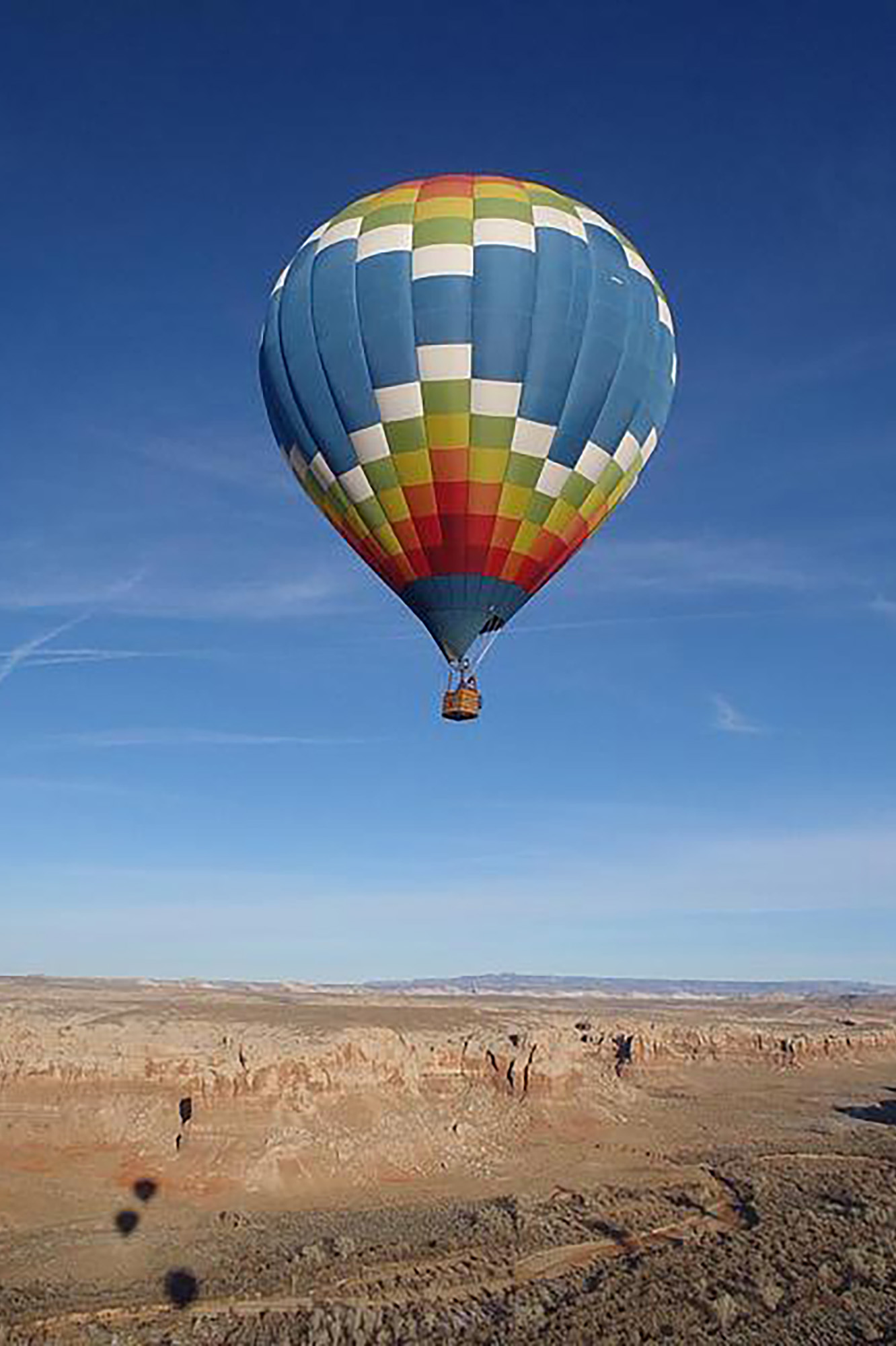 Over a thousand yards of silk-like ripstop nylon contrast against the colors and textures found along Bluff’s expansive, rough-hewn terrain.