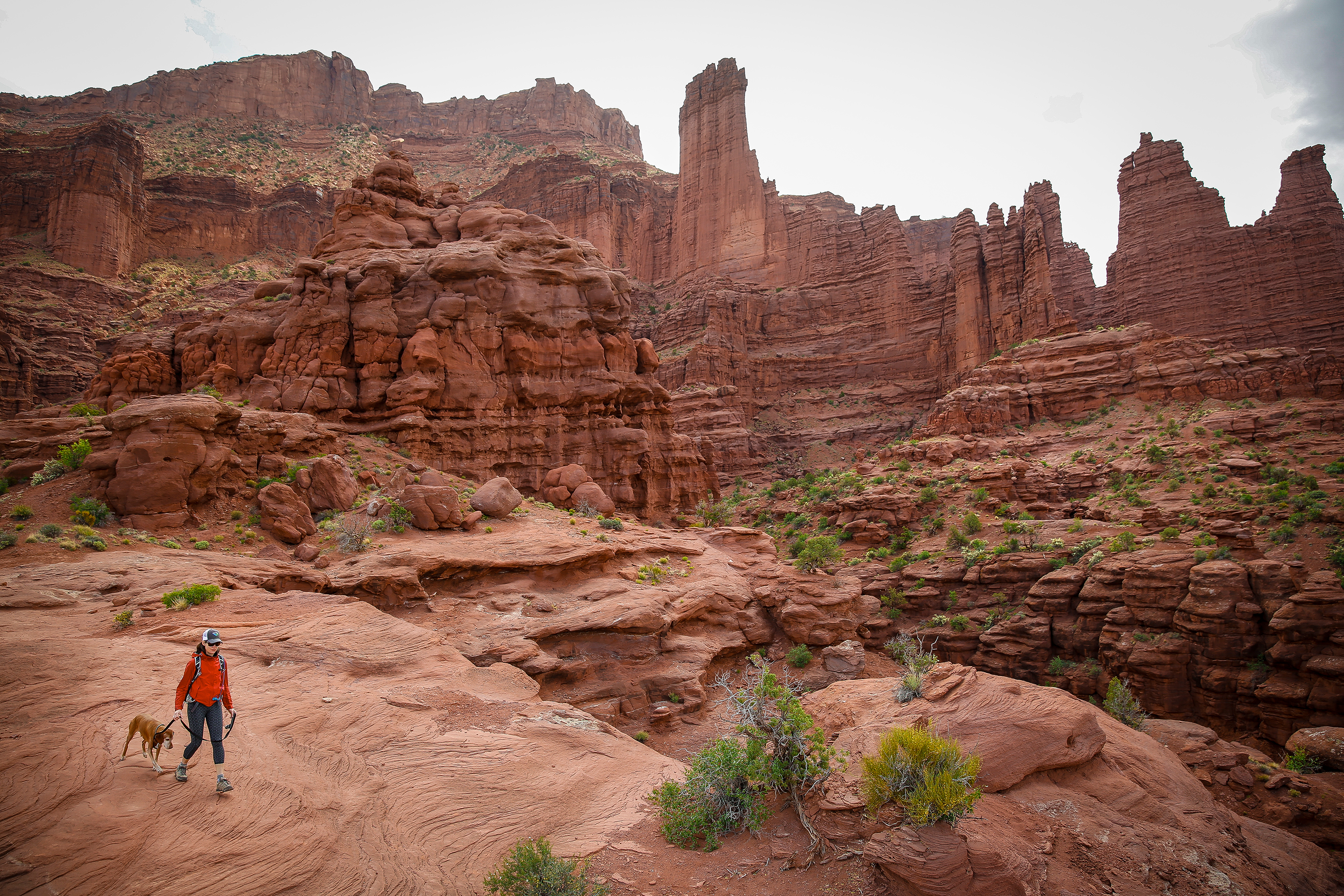 A hiker explores the Fisher Towers near Moab. 