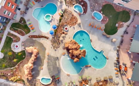 The entire family will enjoy cooling off next to the canyon-inspired splash pad and pool at SpringHill Suites by Marriot Moab.