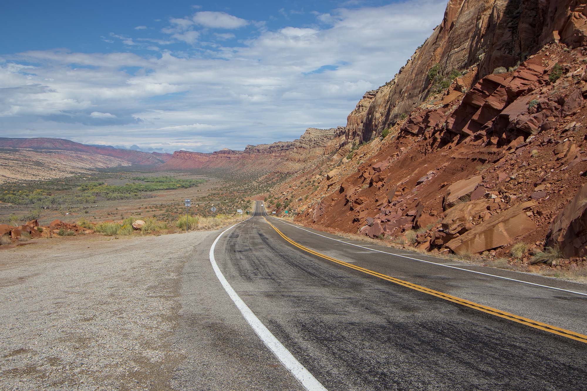 The scenic route along Highway 95 cuts through the steep walls and jagged rocks of Comb Ridge.
