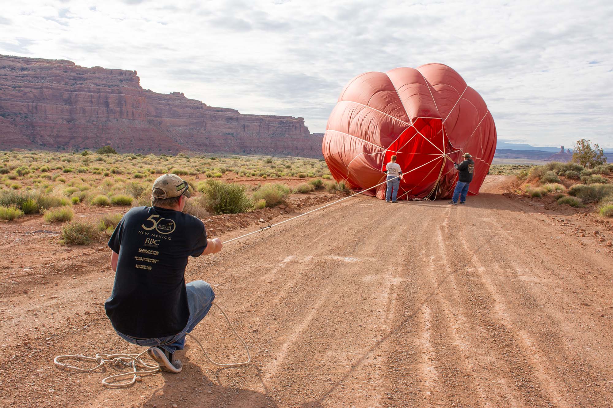 Weightless air still requires a strong and steady set of hands as a balloon takes shape.