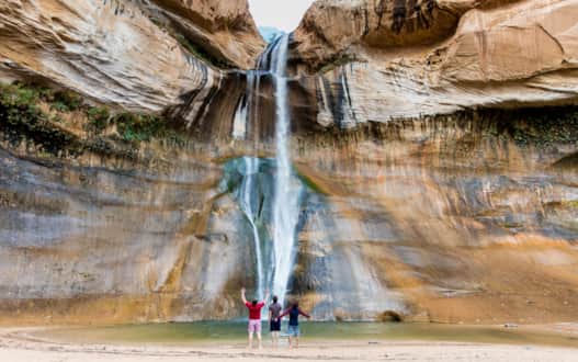 Cool off in the spray of a 126-foot waterfall in the desert: Lower Calf Creek Falls in a premier 6-mile, round-trip hike in the Grand Staircase–Escalante National Monument.