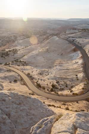 A road winding through white sandstone hills.