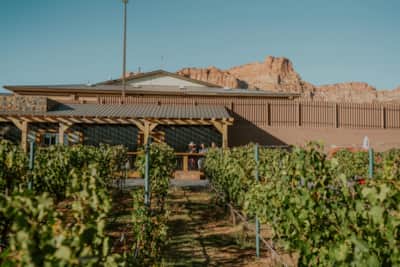 Water Canyon Winery's stunning facility is surrounded by red stone cliffs and has lodging and space for private events.