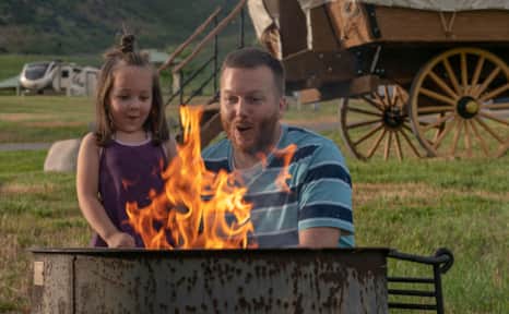 The safest place to build a campfire is in a permanently designated fire pit at a developed camp or picnic site.