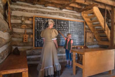 Visit the frontier schoolhouse to try your hand at the Deseret alphabet.