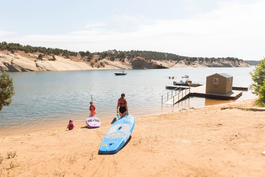 The reservoir is surrounded by sandstone cliffs and secluded sandy beaches.