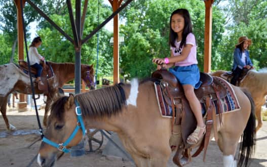 Kids can saddle up for a pony ride supervised by the park’s stable hands.
