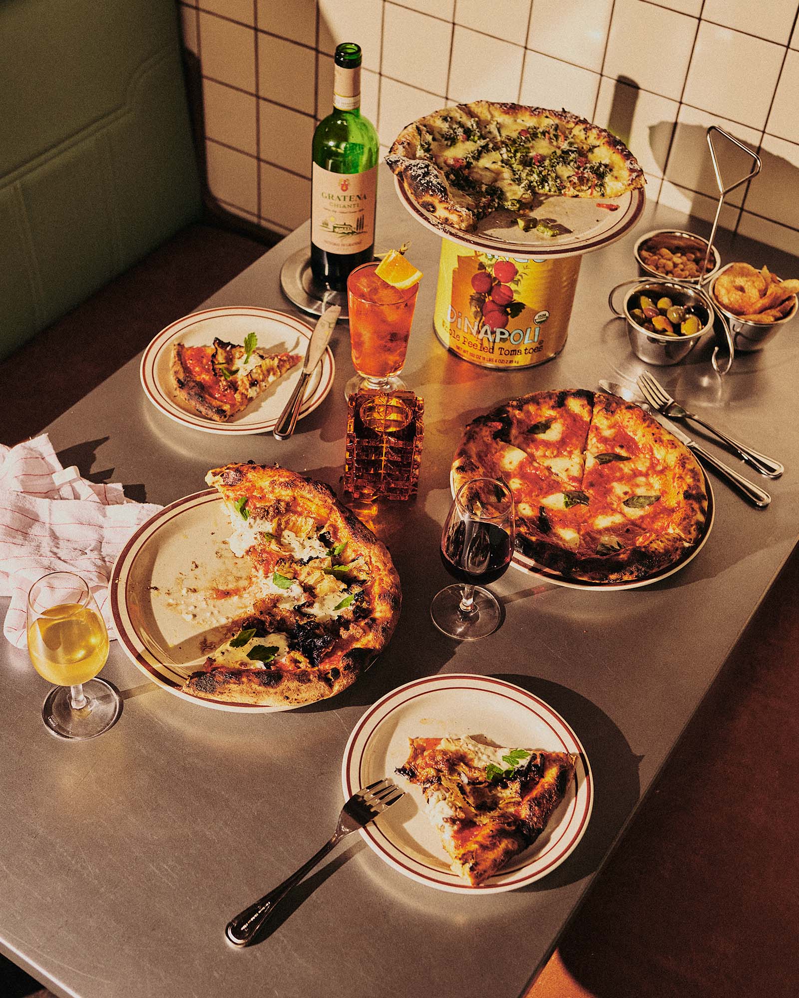 Cosmica features wood-fired pizza and handmade pasta, alongside beverages ranging from fine wines and house cocktails to alcohol-free spritzers, coffees and teas.