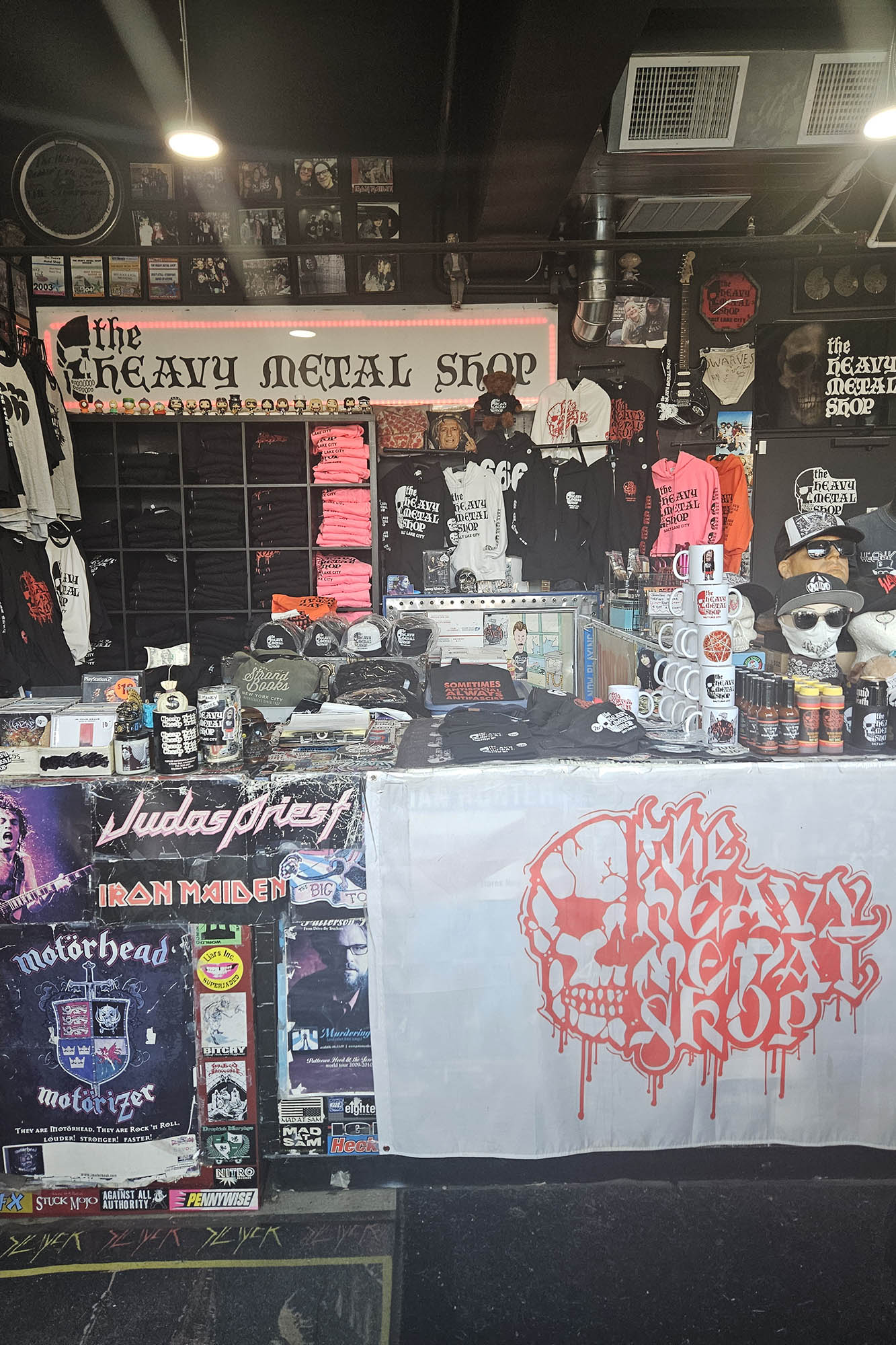The Heavy Metal Shop provides a collection of music merchandise, shirts, hoodies, stickers, patches, hats and even a curated hot sauce selection.