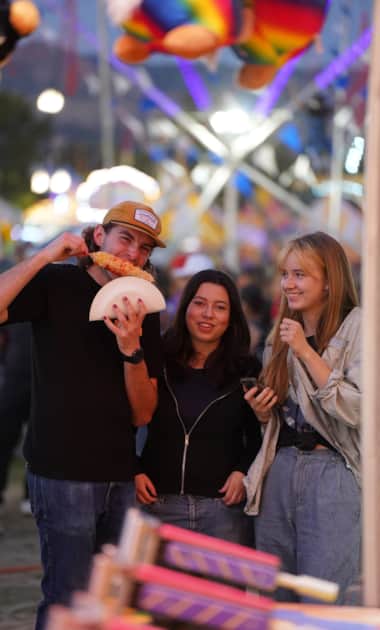 Utah-State-Fair_Fairpark-Fairgoers-Eating_Courtesy-Utah-State-Fair_2024_3
