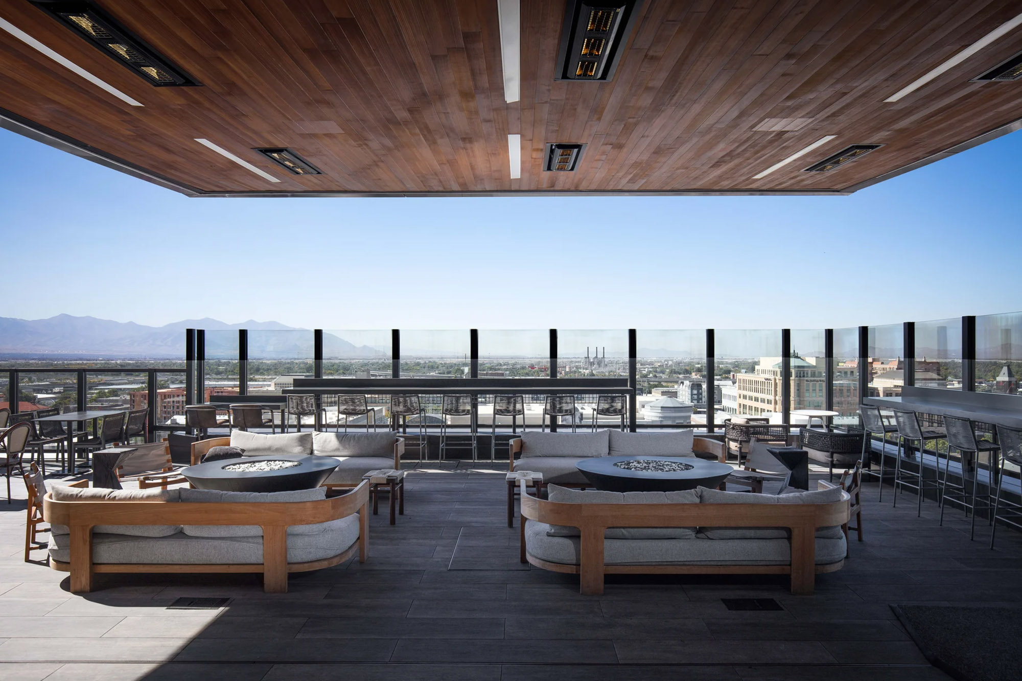 The bar’s rooftop allows guests to gaze out over the lights of Salt Lake City and the towering Wasatch Mountains.