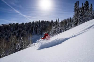 When buildout is complete, the resort will encompass 5,700-plus skiable acres across 10 peaks, served by 37 lifts.