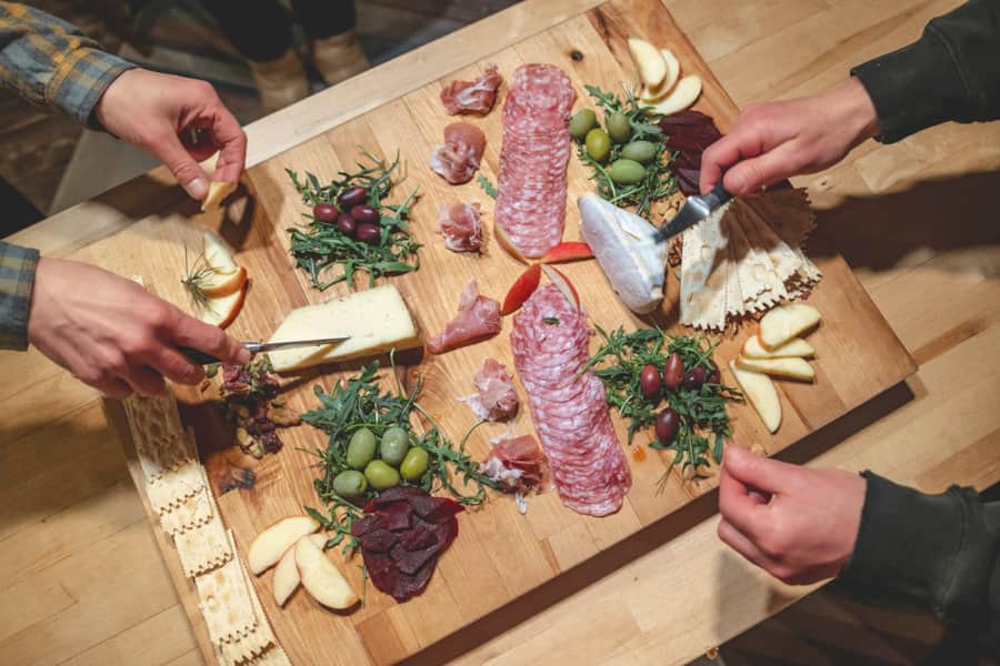 The group enjoys an Instagram-worthy charcuterie board.