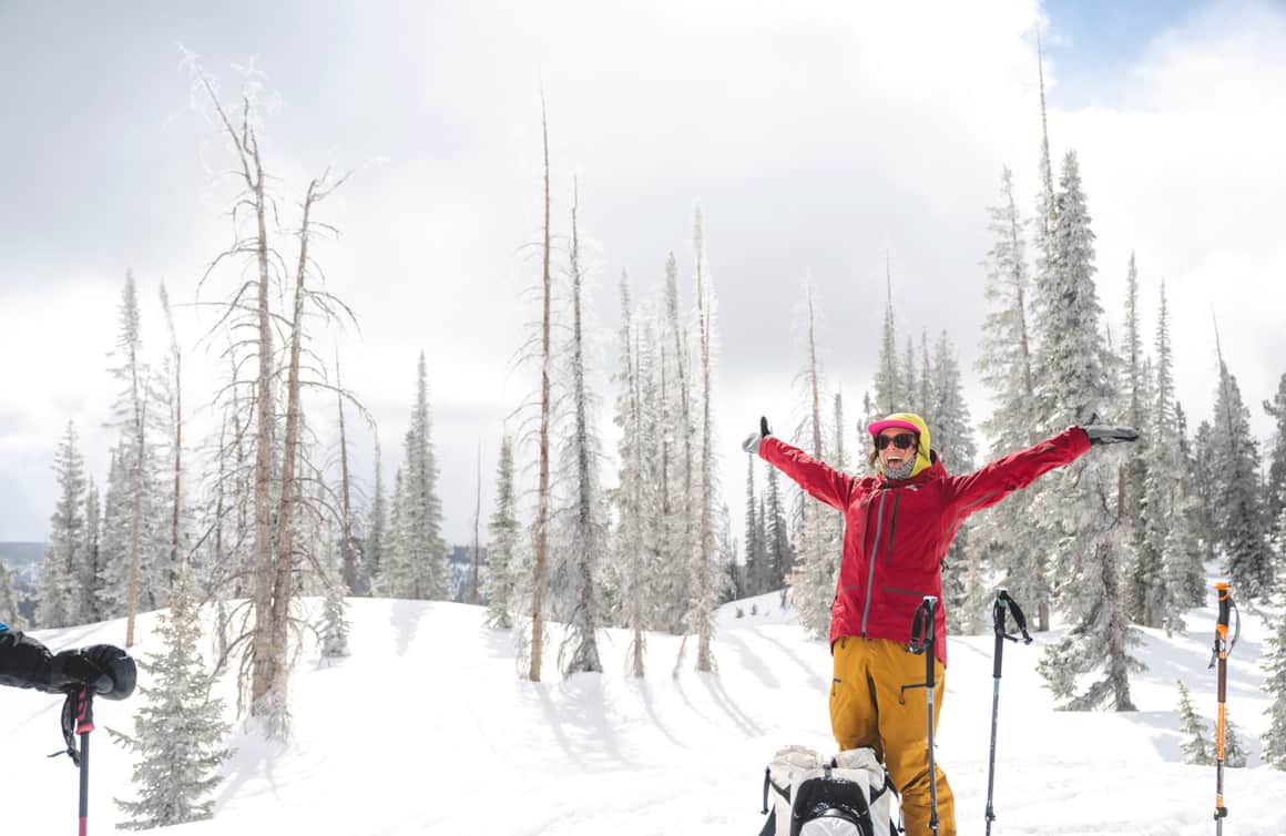 Rachael Burks celebrating a pop of sunshine and the surrounding beauty of the rime-covered trees.