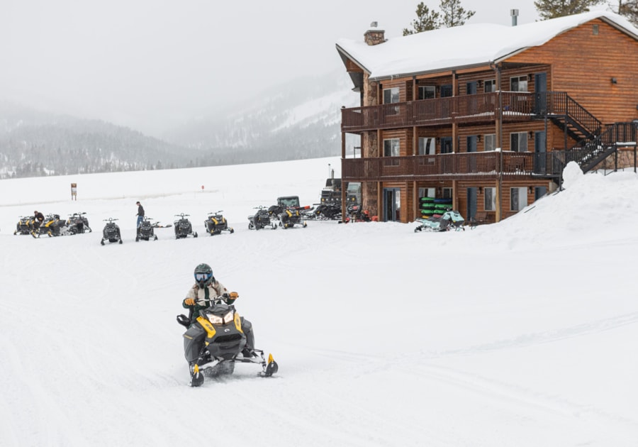 Heading out from Beaver Creek Lodge for a day of snowmobiling in the mountains of Logan Canyon.