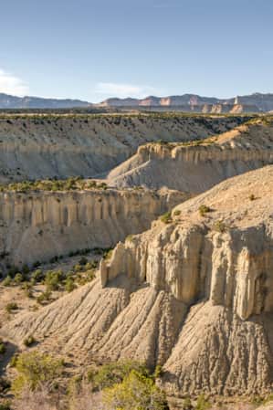 Large white rock formations in a desert landscape.