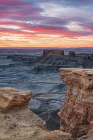 A desert landscape featuring rock plateaus.