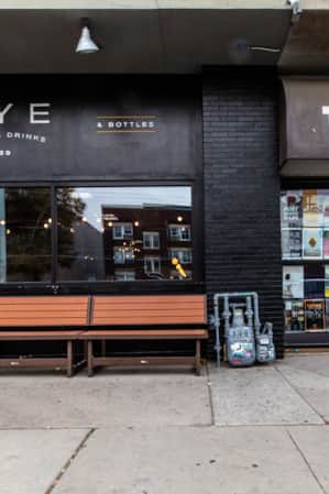 Two side-by-side restaurants with all-black exteriors.