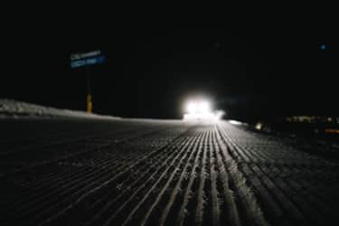 "There’s a lot of teamwork on the hill, a sort of unspoken language and effortless efficiency after working together for years. There’s not much of a need for chatting as each crew member makes a pass on the run, leaving no snow nook untouched."