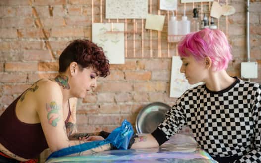 Gheybin Cornish (left), founder of and artist at Everybody Tattoo Studio.
