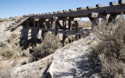 Trestles of wood cut from the Sierra Nevadas and lined with crossties cut from the Raft River or Uinta Mountain ranges still stand.