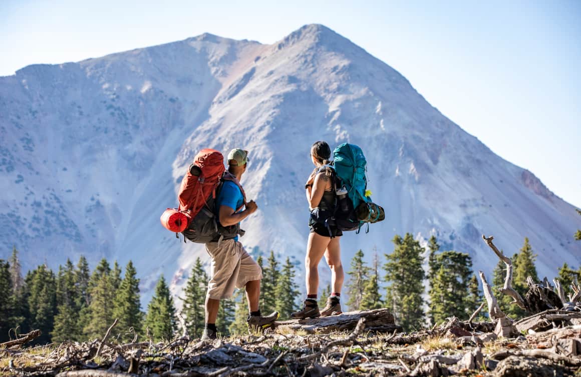 Hikers enjoying the panoramic scenery of Tushar Skyline Trail.