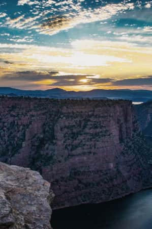 Woman taking a picture along the Canyon Rim Trail at Flaming Gorge.