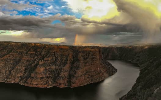 Monsoon weather over Flaming Gorge. The easily accessible Canyon Rim Trail lets visitors take in stunning views without much effort.