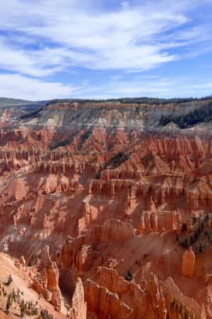 A canyon with hoodoos scattered along its sides.
