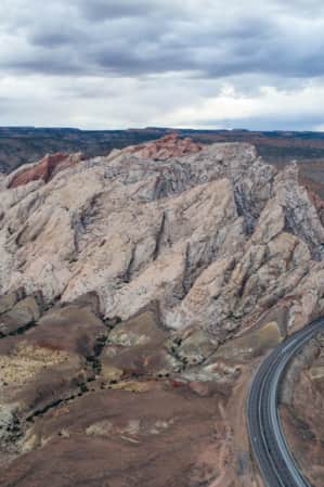 A road cutting through large rock formations.