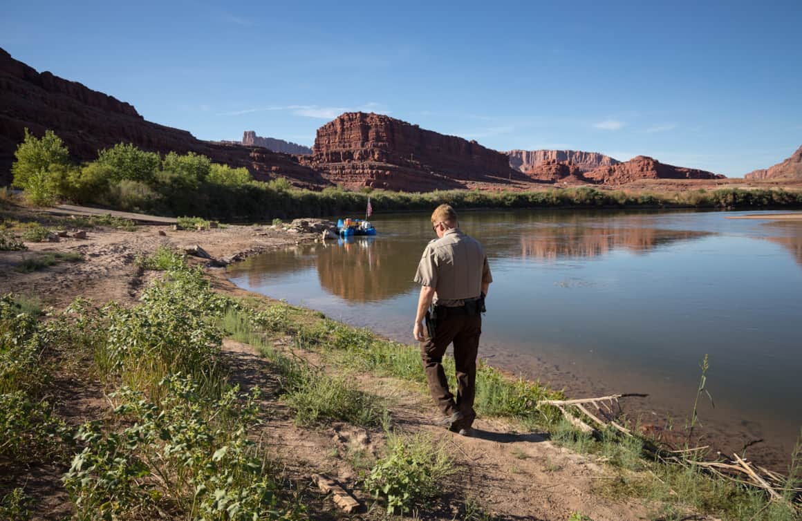 As a law enforcement river ranger, Young patrols the Colorado River by boat.