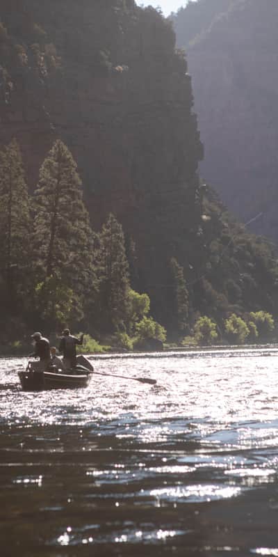Fly fishermen drift on the Green River in Utah.