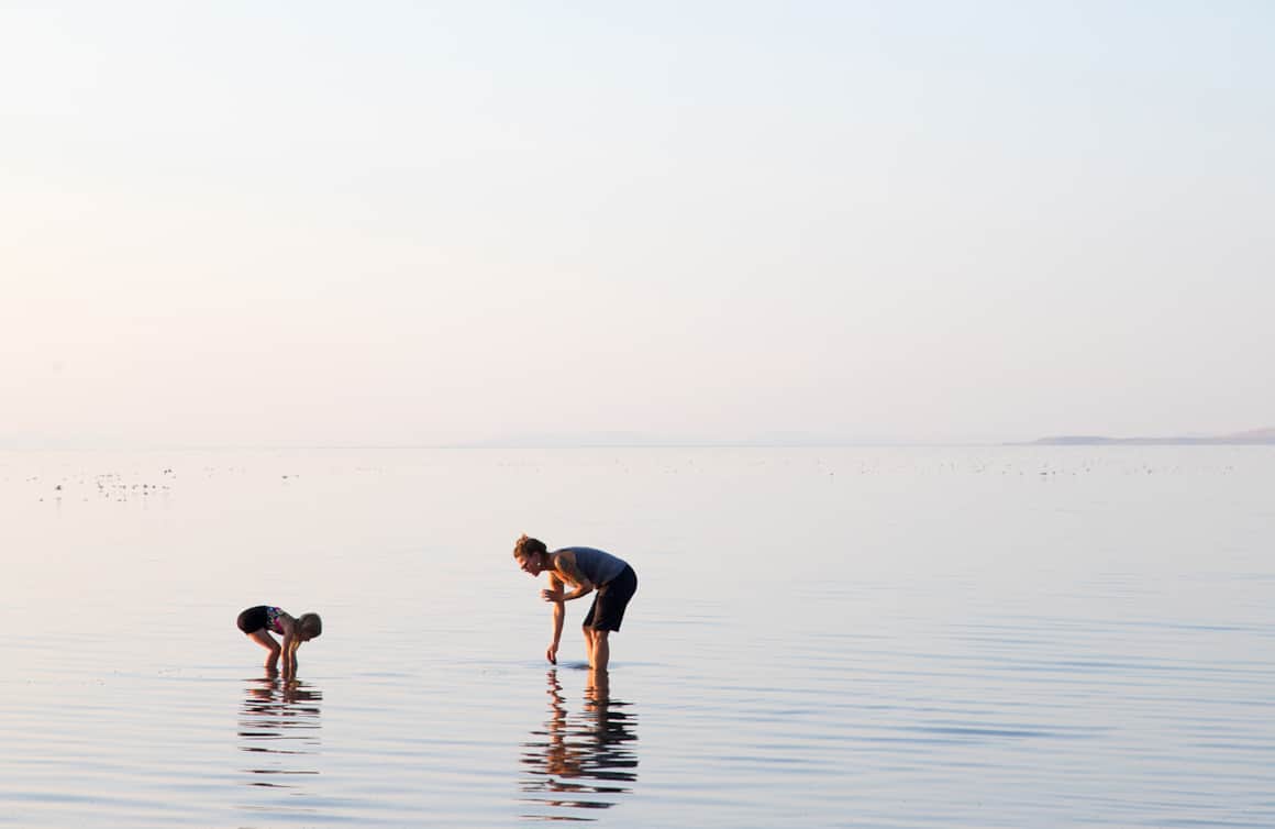 Biologist Jaimi Butler and her daughter examine the fauna of the Great Salt Lake.
