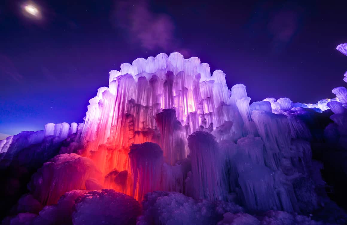 At nighttime the ice castles transform into a technicolor wonderland.