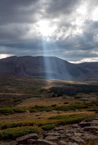 Late afternoon sun breaks through to spotlight the Henry’s Fork Basin in the High Uintas.